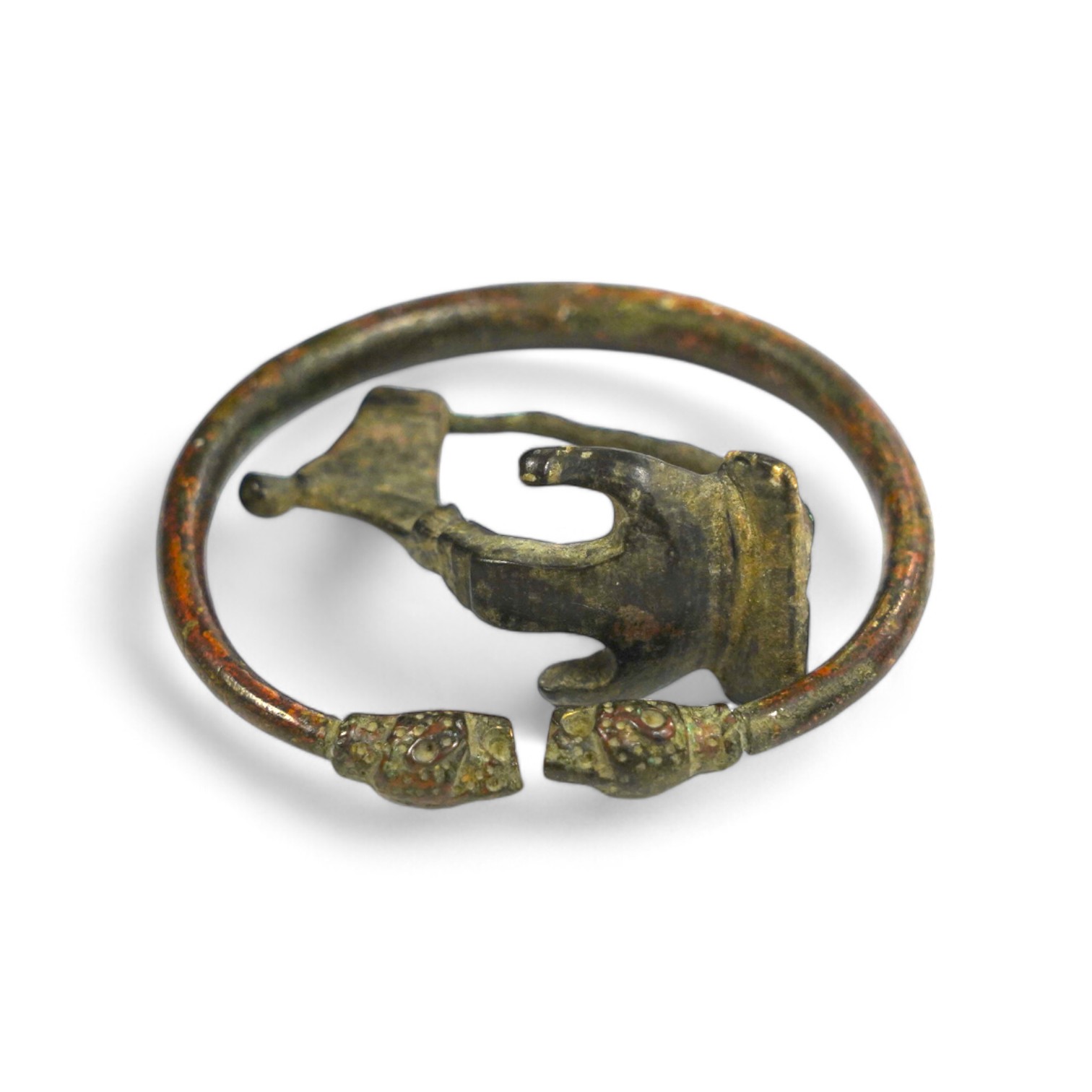 A bronze bracelet, probably Luristan and a Roman bronze fibula brooch (2). Condition - fair